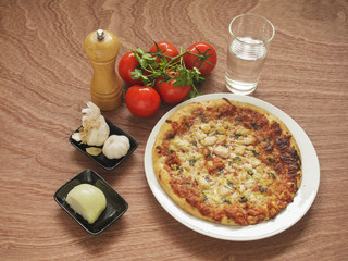 Pizza with traditional ingredients. 