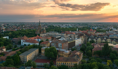 Fototapeta na wymiar European city skyline seen by a professional drone at sunset and cloudy sky