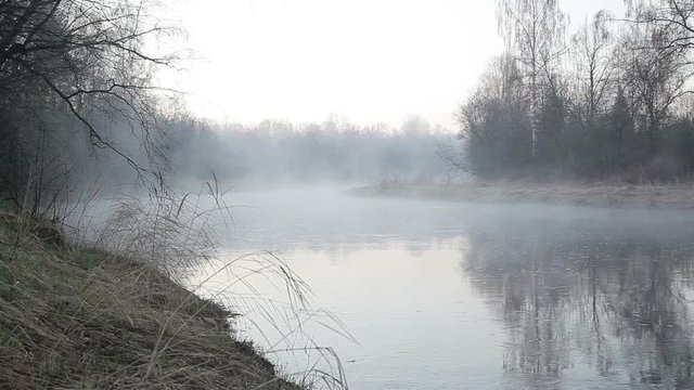 Early morning on the foggy river in the spring in Northern Europe