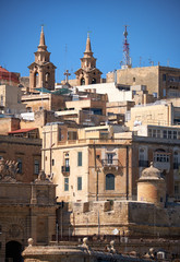 Obraz premium The view of the residential houses of Valletta with two Bell Tow