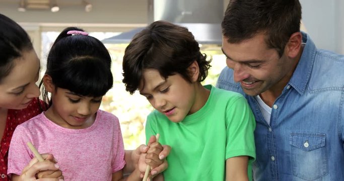 A happy family is cooking together