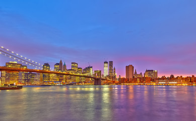 Brooklyn bridge and Manhattan at dusk, New York City