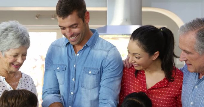 A multi generation family is reunited for cooking