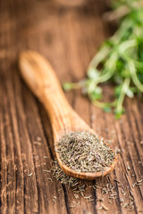 Dried Thyme on wooden background