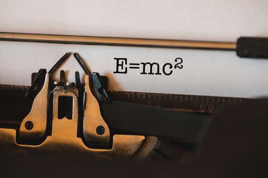 E=mc2 against close-up of typewriter
