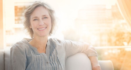 Happy woman relaxing on her couch