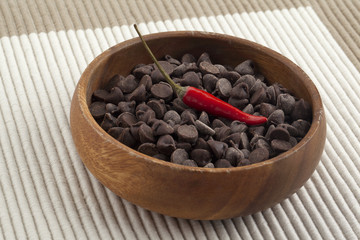 chocolate chips and chili on the wooden bowl