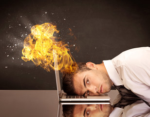 Stressed business man's head is burning
