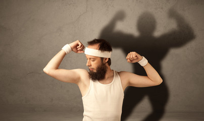 Naklejka premium Skinny man with musculous shadow