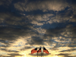 american flags with cloudy sunset sky