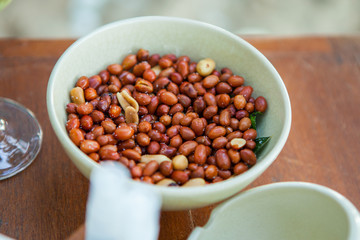 Deep fried peanuts in bowl.