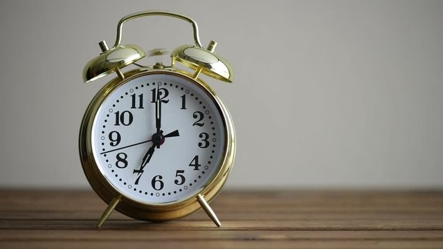 Ringing vintage golden alarm clock