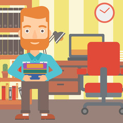 Man holding pile of books.