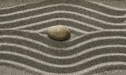 Fototapeta na wymiar Stones and a line on the sand.