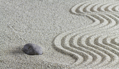 Fototapeta na wymiar Stones and a line on the sand.