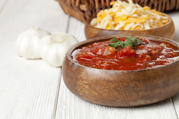wooden bowl with salsa dip
