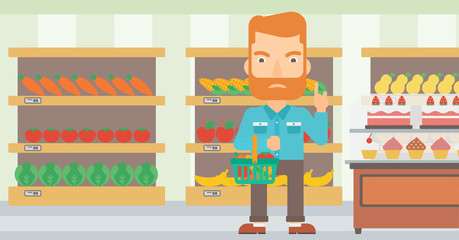 Man holding supermarket basket.
