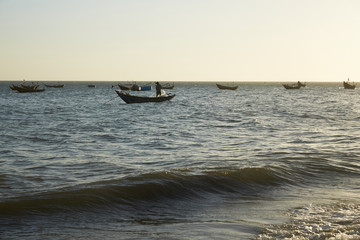 fishing boats on the shore in Vietnam