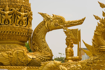 Gold garuda carving on the ship at Thung Sri Muang park in Ubon Ratchathani province, Thailand