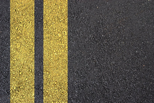 Asphalt surface with yellow line