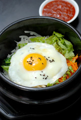 Rice with vegetable in hot bowl Korean food