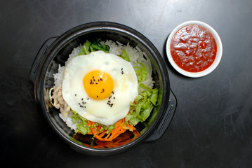 Rice with vegetable in hot bowl Korean food