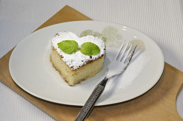 Traditional Turkish dessert revani on wooden board