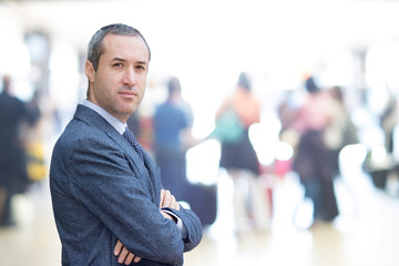Successful business man looking confident , outside office on th