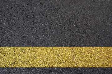 Asphalt surface with yellow line