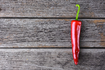 Red chilies on the rusty wooden table