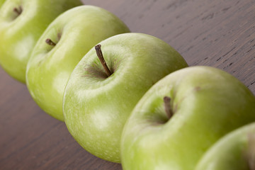 angled shot of a row of apples