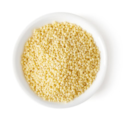 Bowl of millet groats on white background, top view