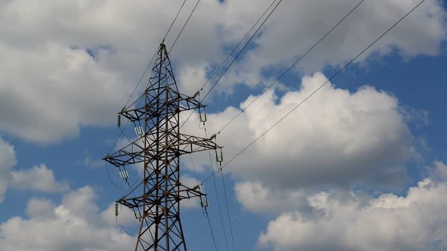 High-voltage power line on sky background, taymlapse