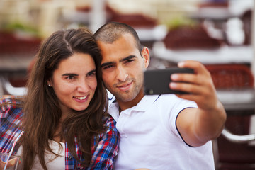 Couple making selfies