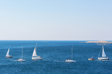 Fototapeta premium Sailboats sailing in a sea lane in the sea