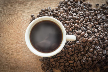 cup of coffee on wood backgound