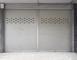 Old building with a rusty roller shutter door