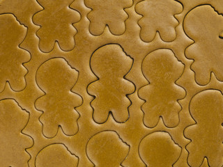 shape of gingerbread man and dough.