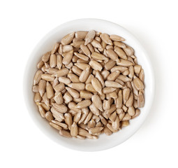 Bowl of sunflower seeds isolated on white, top view