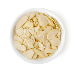 Bowl of almond slices isolated on white, top view