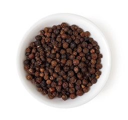 Bowl of black pepper isolated on white, top view