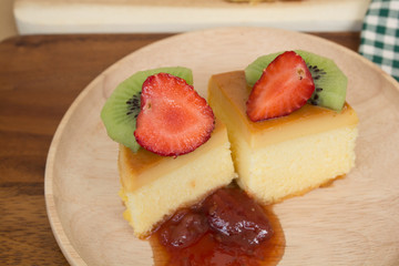 custard cake fruits jam on wood plate