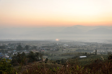 colorful of sunrise made with star filter and view mountains in the winter landscape