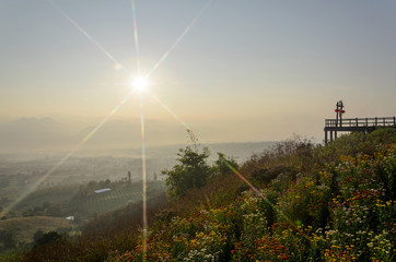 Obraz premium colorful of sunrise made with star filter and view mountains in the winter landscape