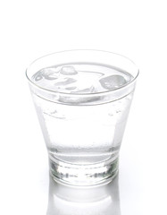 Glass of water with ice isolated on white background.