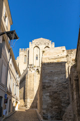 Fototapeta na wymiar Avignon, France. Street of the old town, overlooking the Palace of the Popes