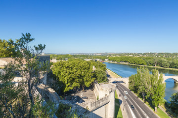 Fototapeta na wymiar Avignon, France. Fortifications on the banks of the Rhone River and the bridge of St. Benedict (included in the UNESCO World Heritage list)