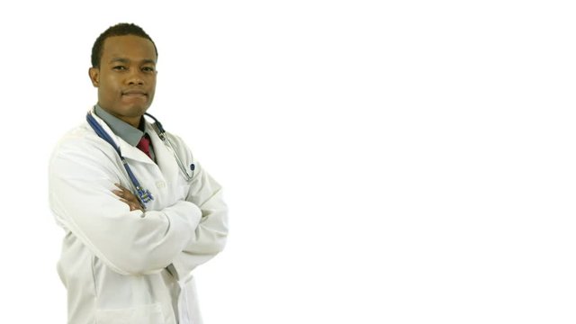 An African American physician with arms crossed turns and stares with determination into the camera. Isolated on white 