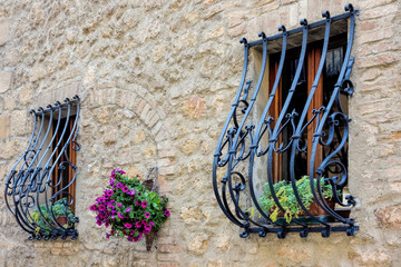 Wrought iron security bars over windows in Pienza