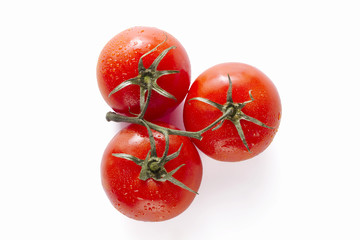 overhead shot of three ripe tomatoes